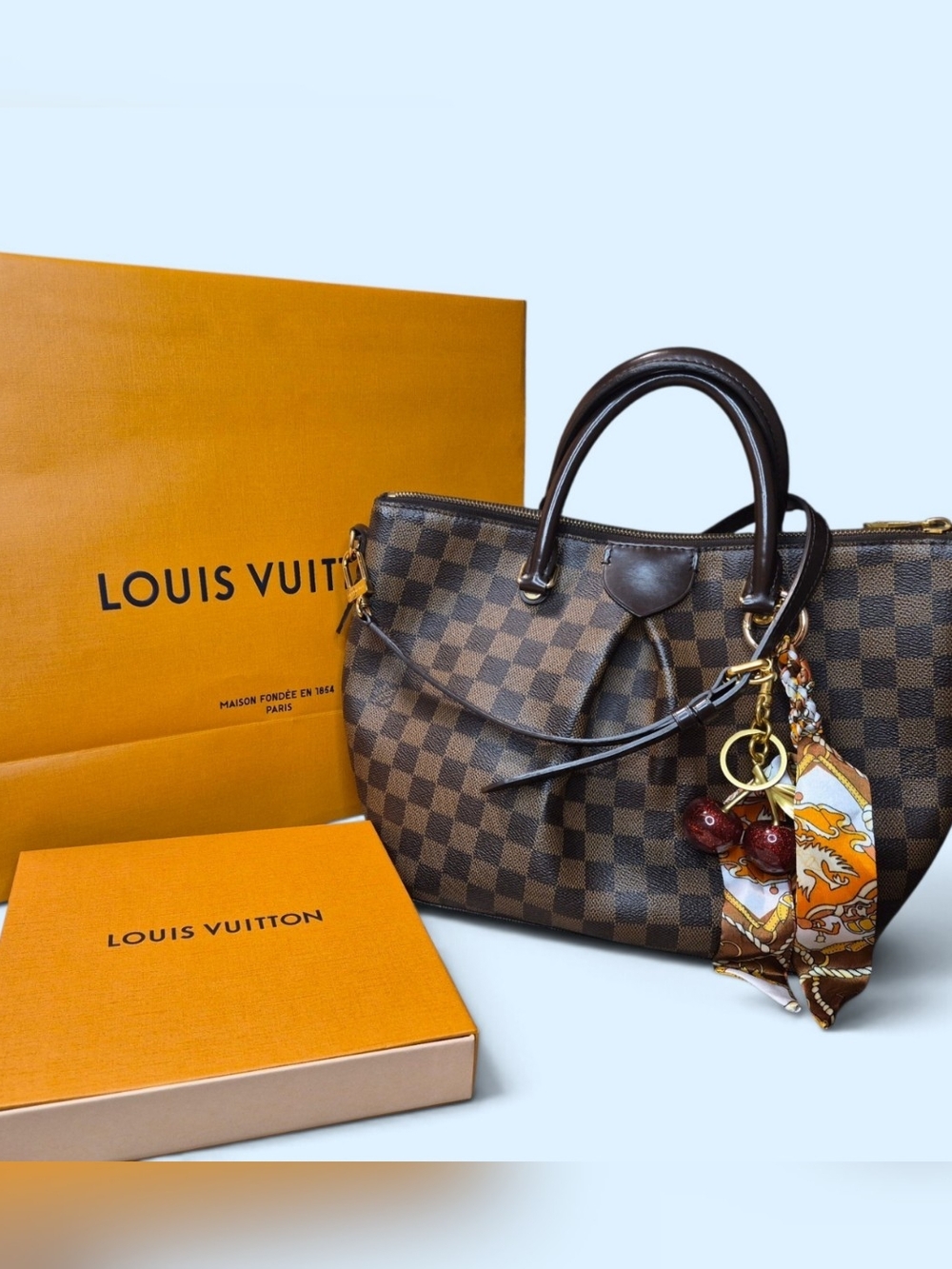 Louis Vuitton Tivoli PM Damier Checkered Tote in Brown